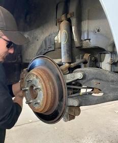 Close-up of a new car brake disc and caliper.